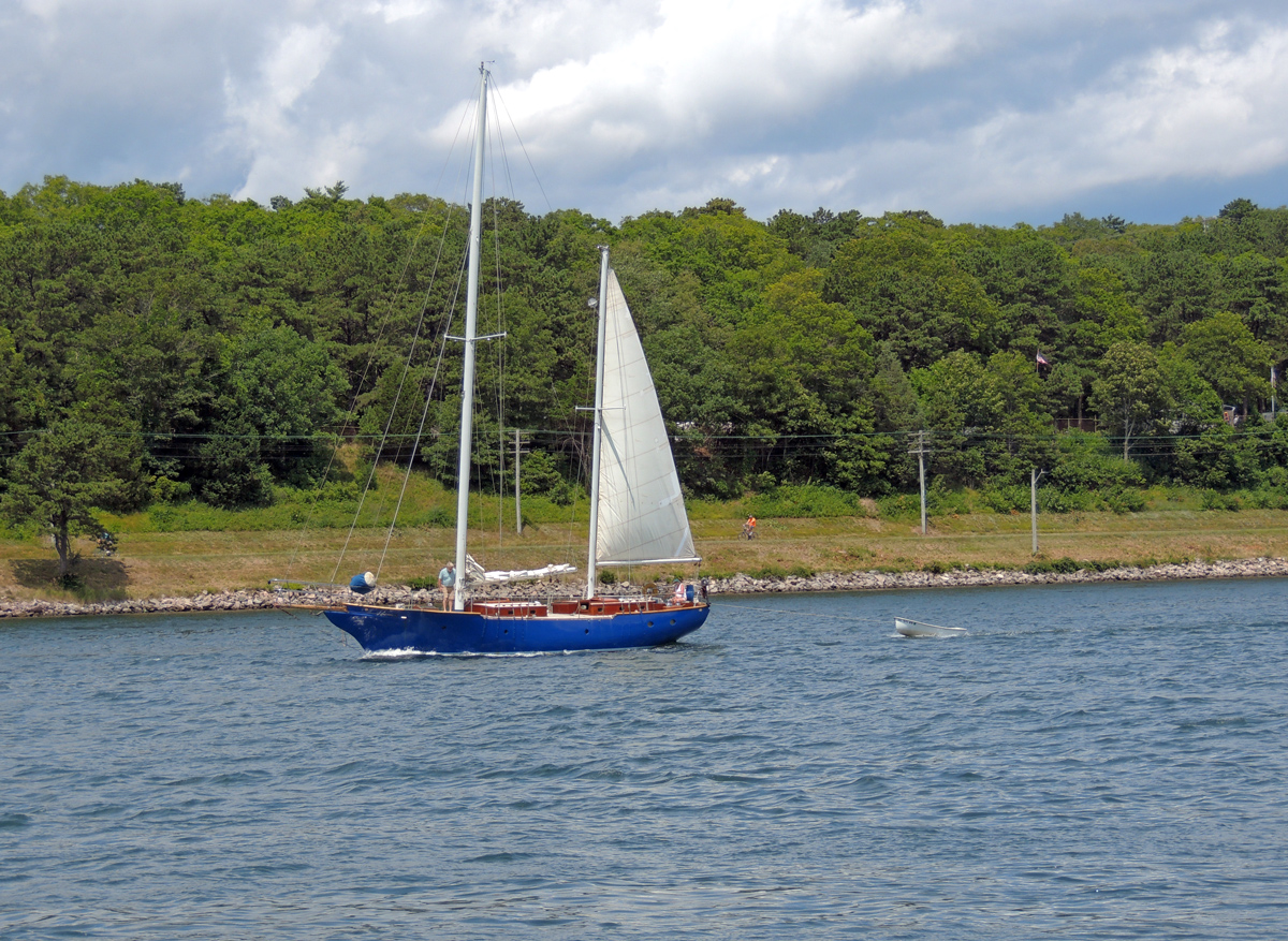 blue hull sailboat